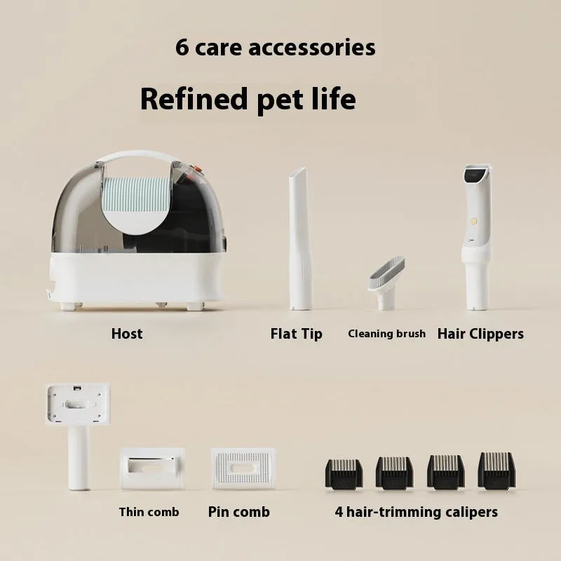 Pink and white pet hair vacuum cleaner with grooming clippers, hose, and attachments on white background