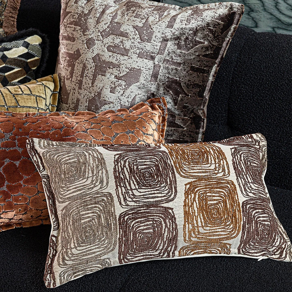 Cream and coffee coloured abstract coil pattern square pillow cover made from polyester feather velvet.