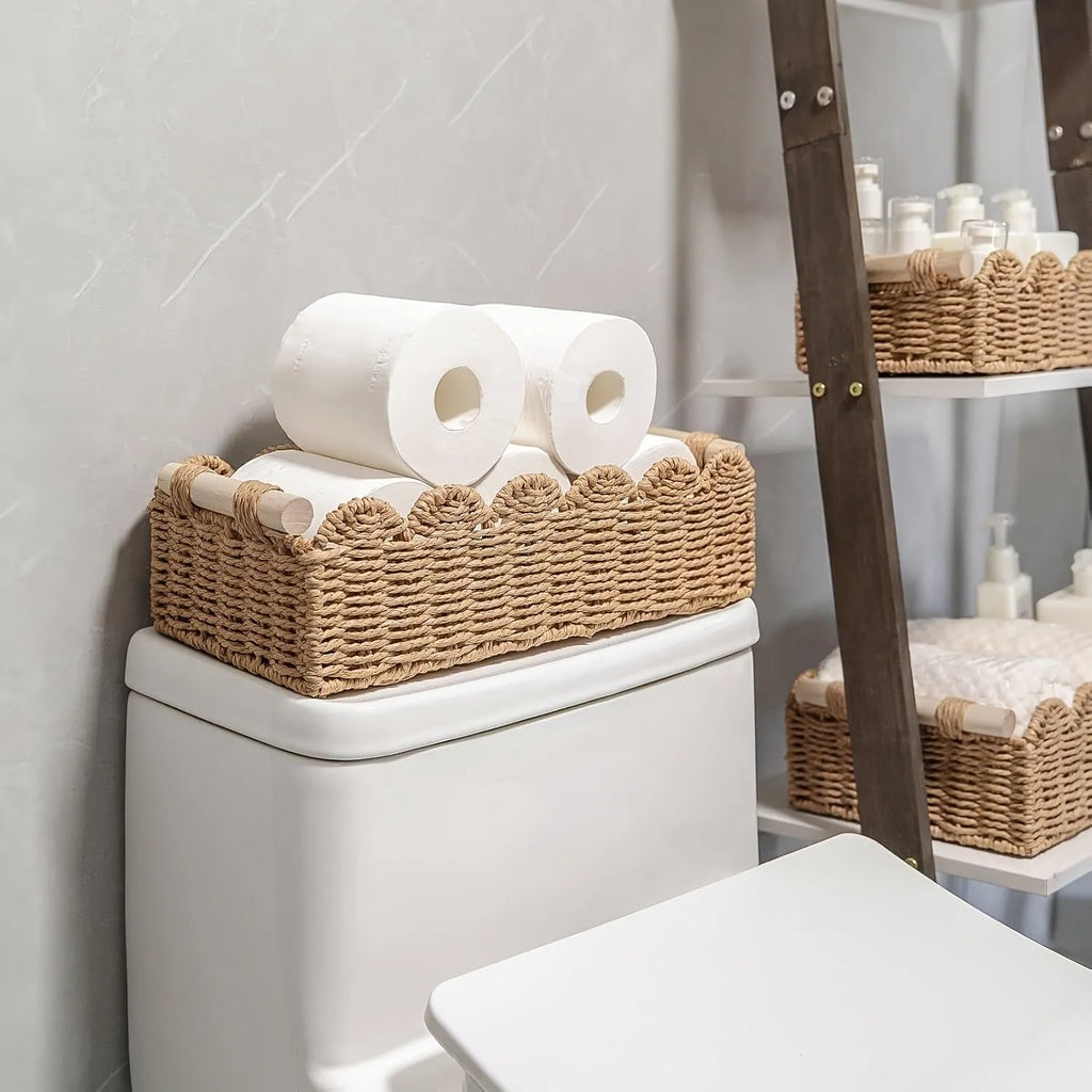 Rectangular woven paper storage basket in a neutral colour on a wooden tabletop.