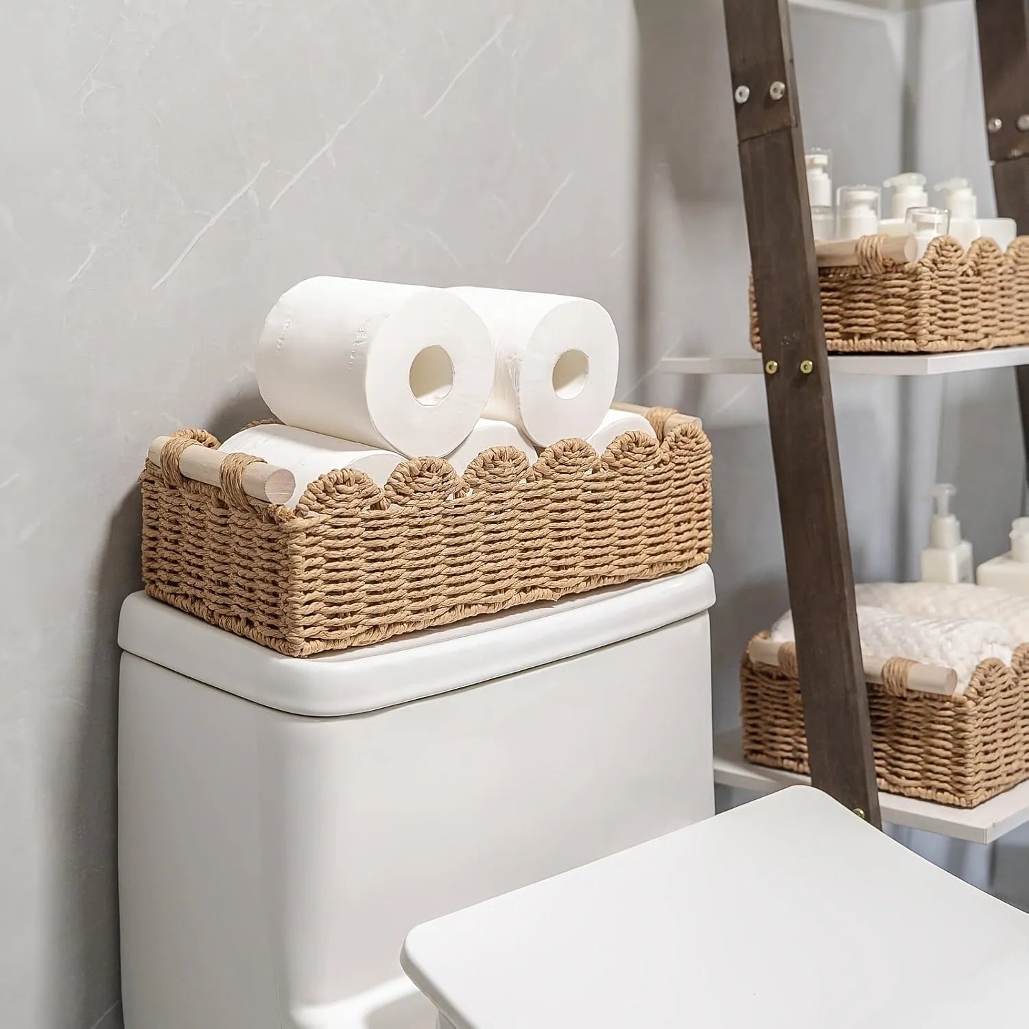 Rectangular woven paper storage basket in a neutral colour on a wooden tabletop.