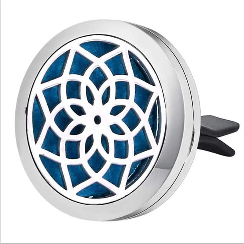 Round stainless steel car air vent perfume clip with polished finish, 30mm diameter, available in eleven steel colours and three patterns.