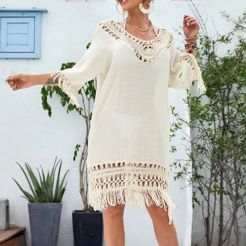 Apricot crocheted patchwork beach dress with half sleeves and mid-length cut on mannequin