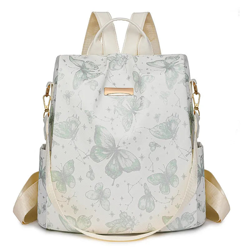 Butterfly print backpack with sewing line detail shown in multiple colour options