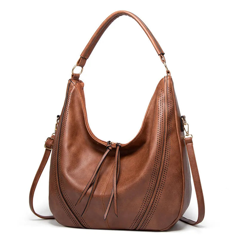 Women's soft PU leather tassel hollow shoulder bag in vertical square shape with sewing line details, black colour