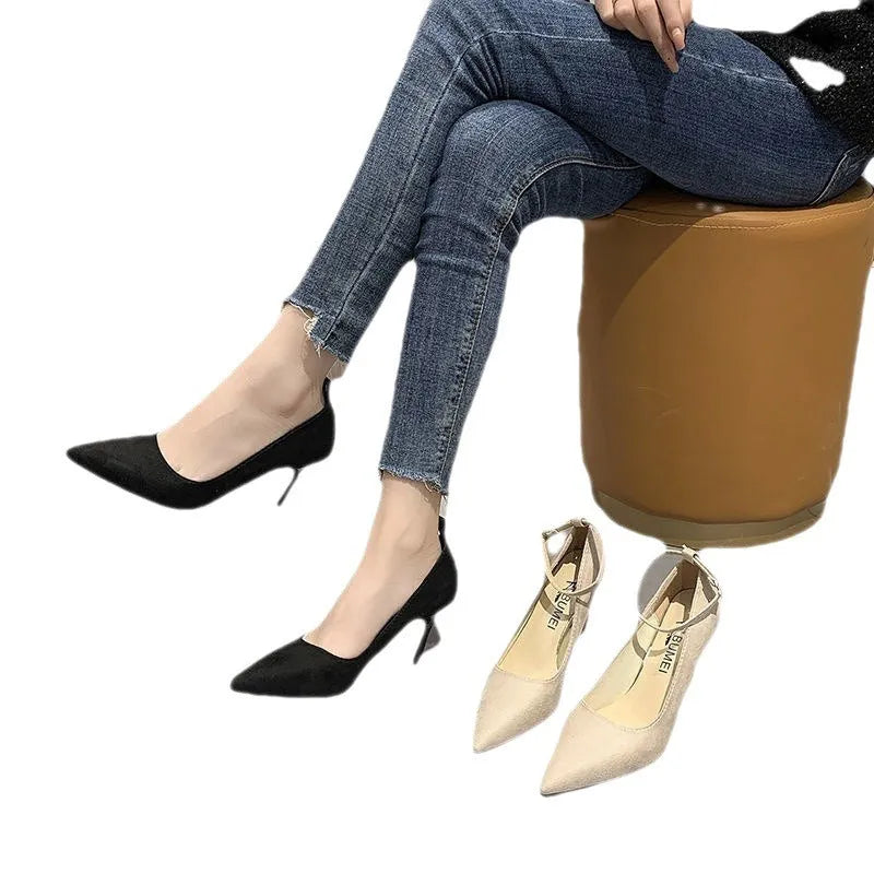 Women's black stiletto heels with buckle detail and skull pattern, showing 8cm heel