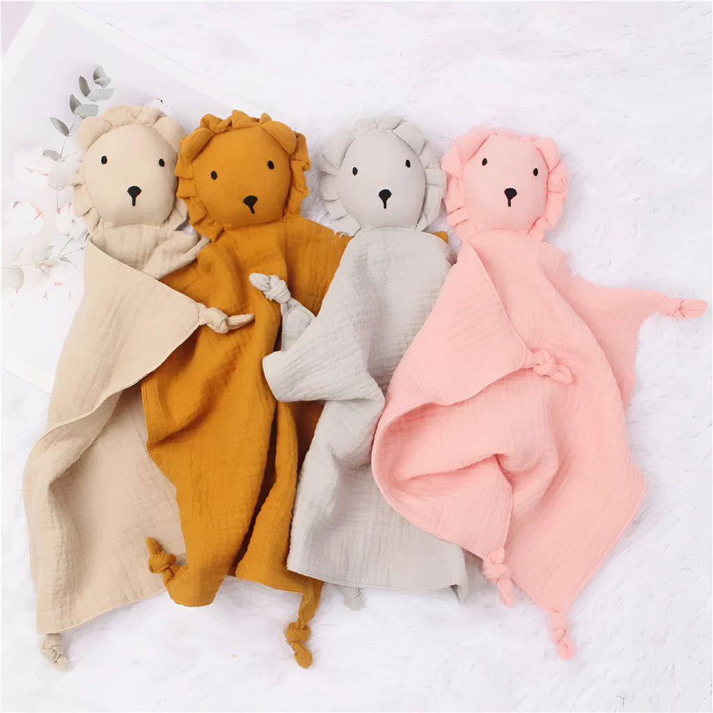 Baby muslin cotton gauze comfort towel 30x30cm in brick red, used as a sleeping towel for infant with lion design