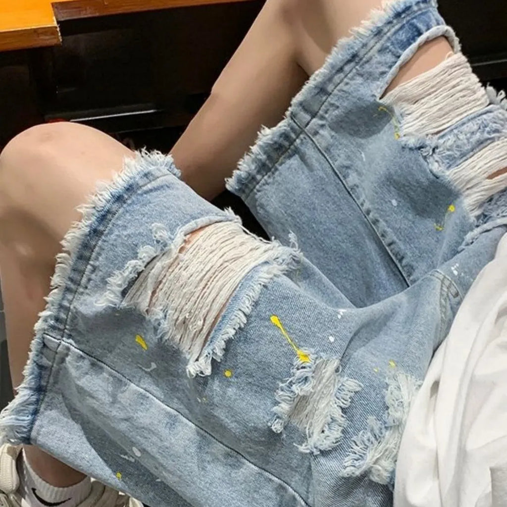 Men's water washed hole denim shorts in loose street style cut, available in black or light blue colours