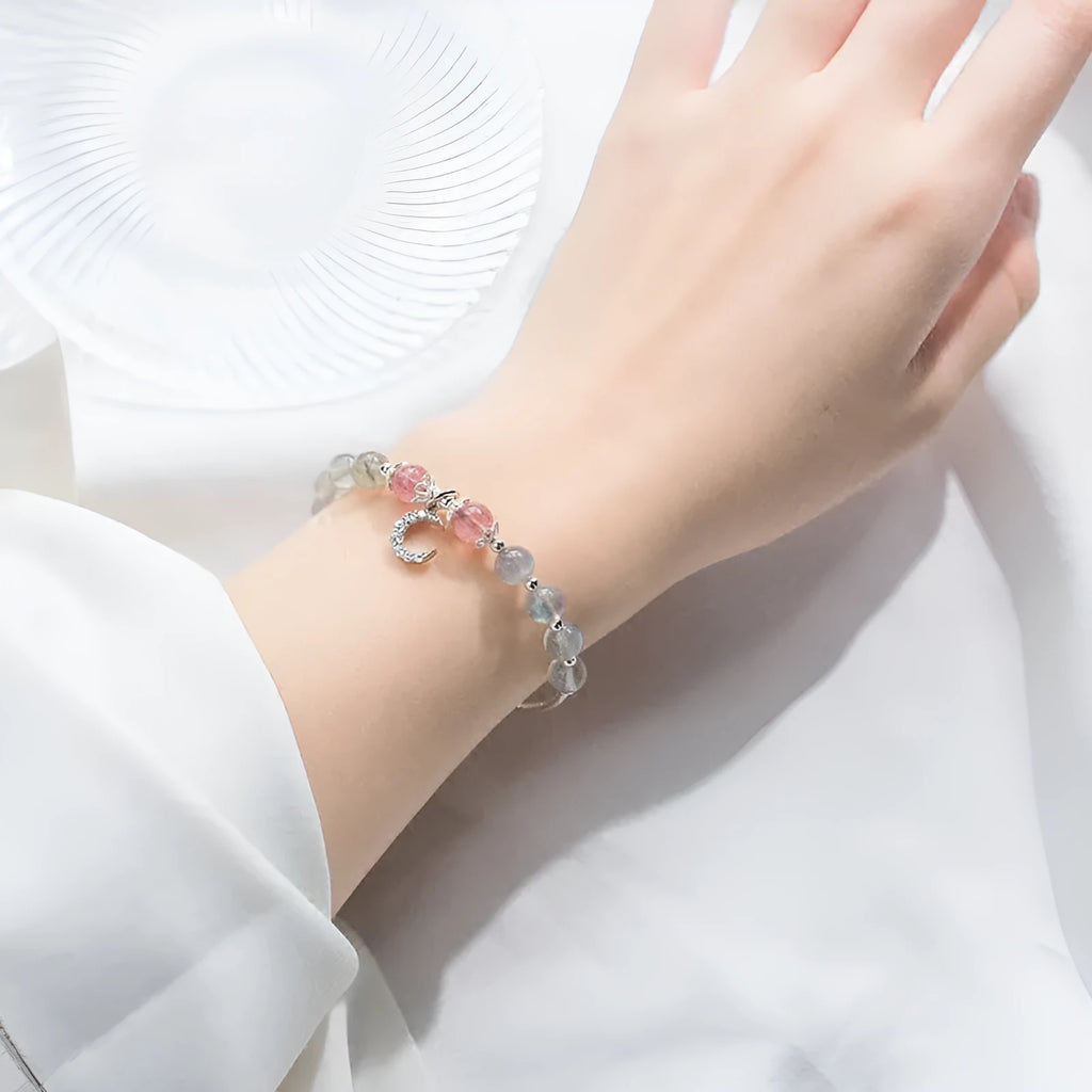 Handmade adjustable bracelet with a natural moonstone centre on a silver-toned chain.