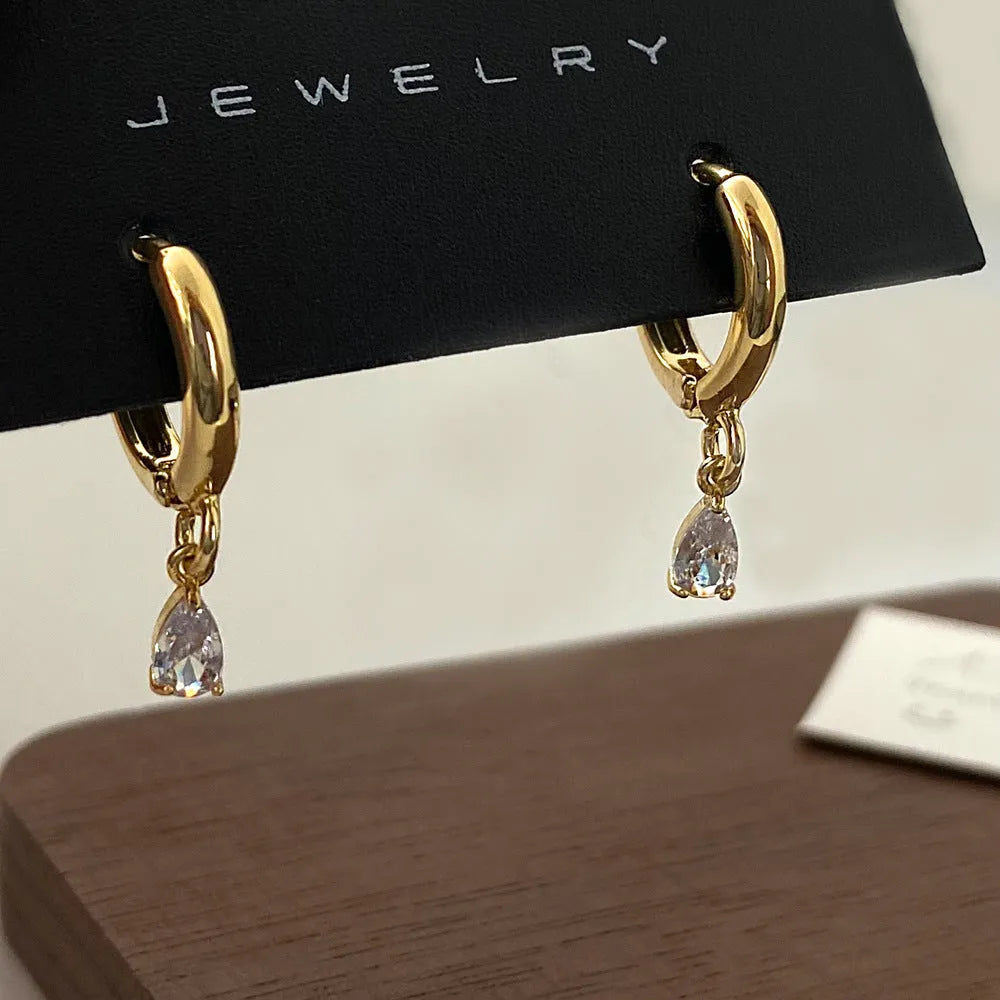 Zircon jewellery set with geometric meteor shower design including necklace, earrings and anklet