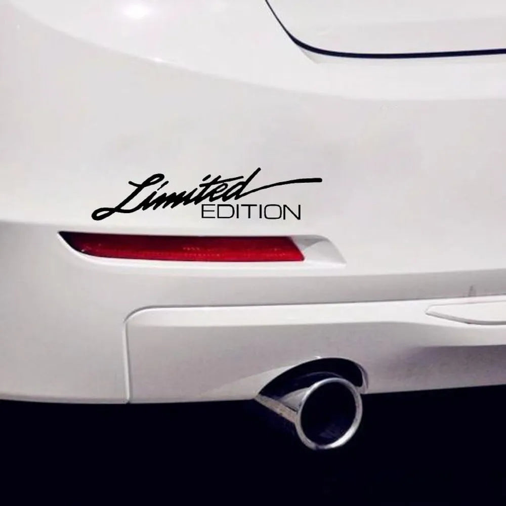 British reflective plastic bumper sticker shown in black, white and colourful variants, dimensions 16cm by 3.8cm.