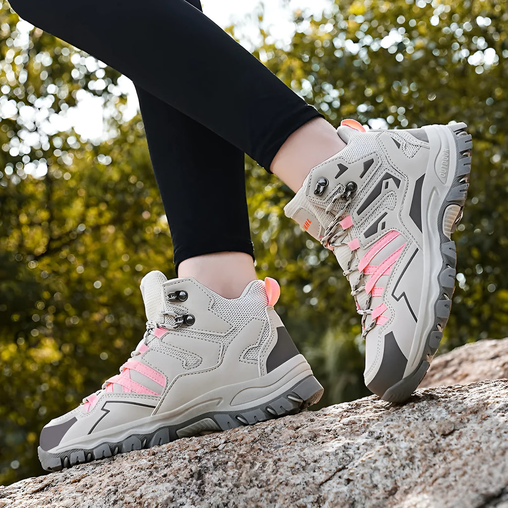 Low-top hiking sneakers in multiple colours with rubber sole and lace-up front for outdoor wear.