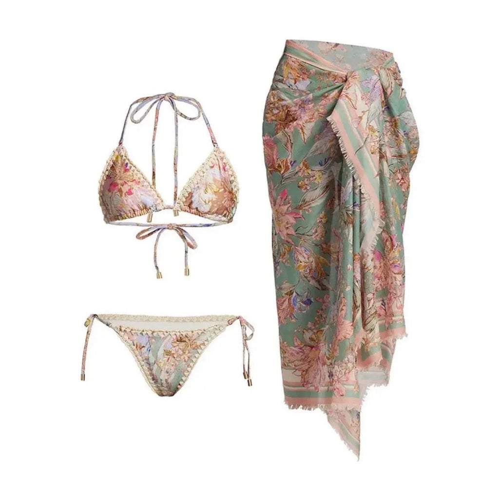 Women's floral pattern bikini set with top, briefs, and skirt in creamy-white colour
