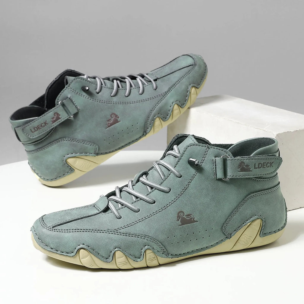 Men's khaki high top octopus shoes with round toe and mid-cut design on a rubber sole.