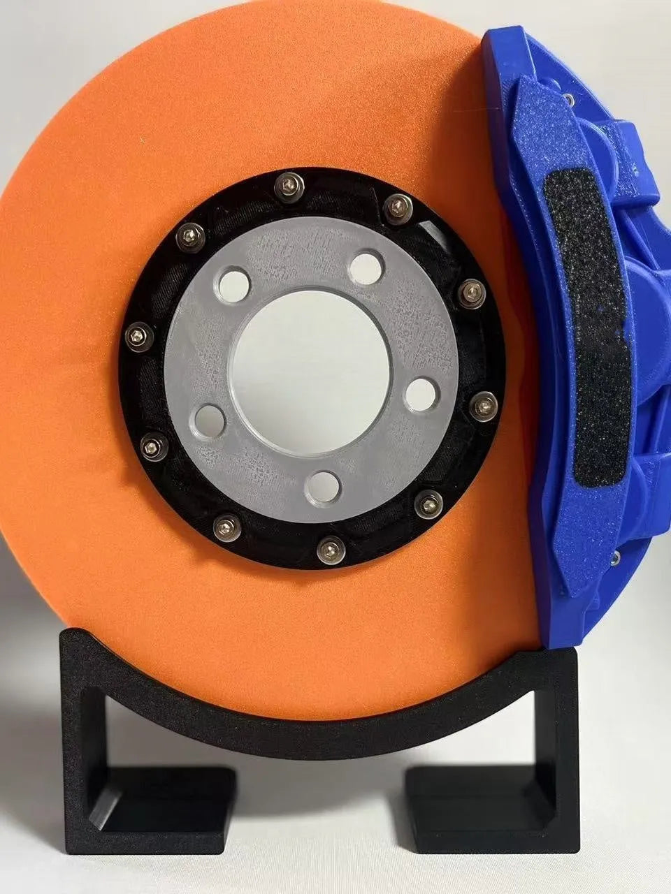 Blue brake disc LED night light with bracket on desk, showing 24cm disc and touch switch