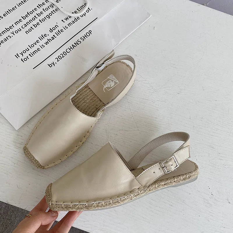 Women's beige canvas fisherman flat sandals with a soft fibre lining, shown from the side.