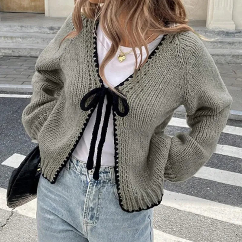 Women's gray loose-fit cardigan with crocheted flower detail on the front