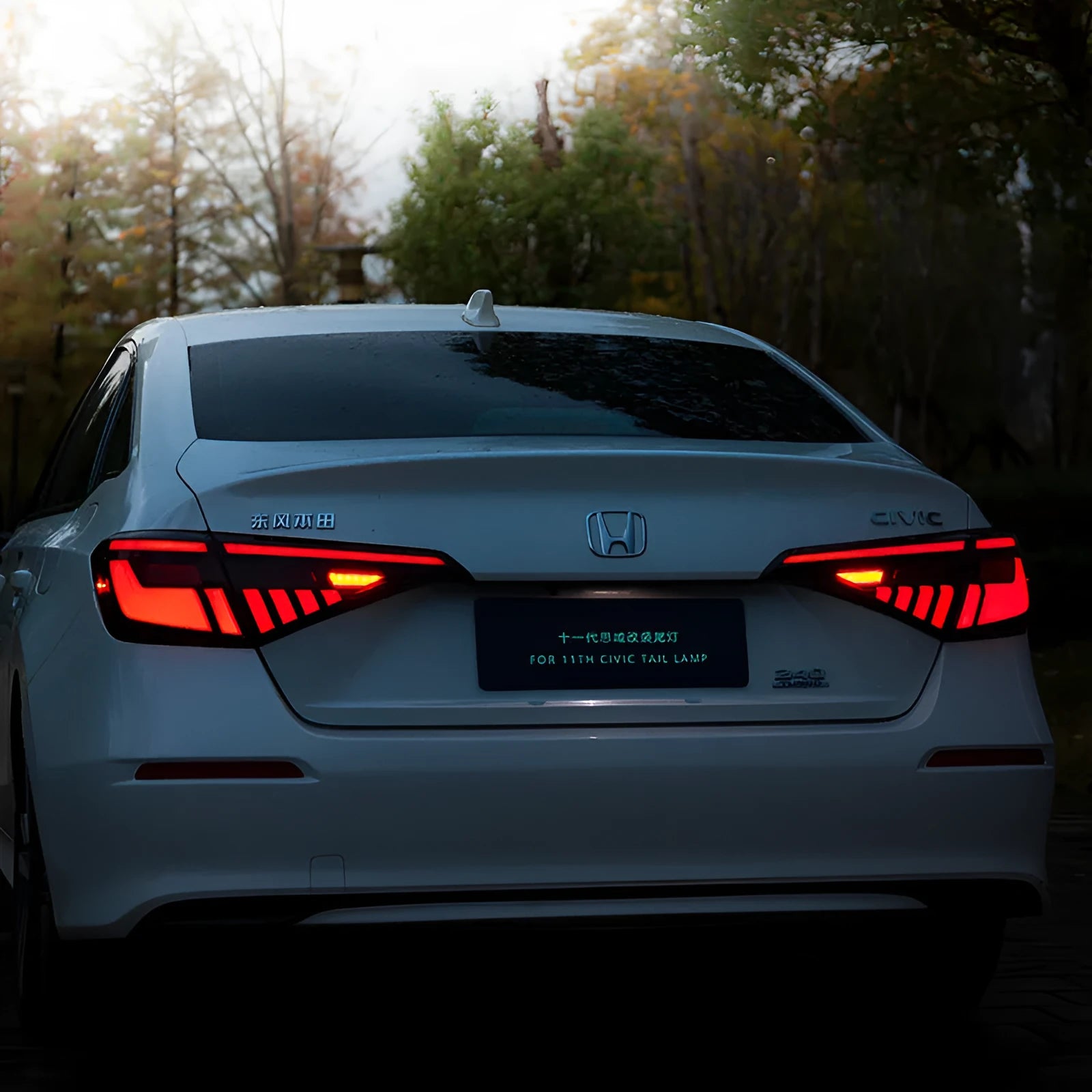 11th generation Honda Civic black and red LED tail light assembly with sequential indicators