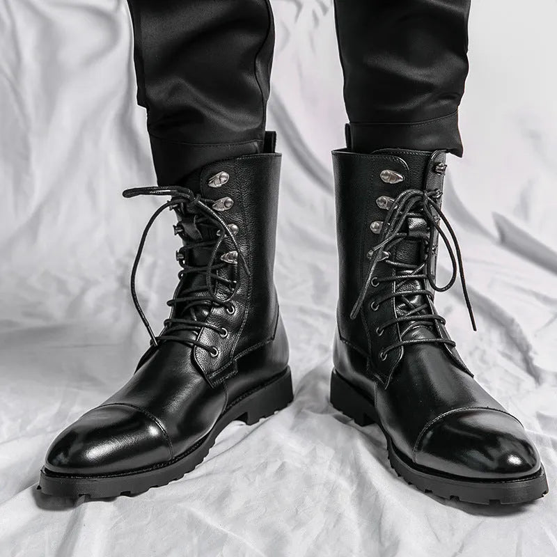 Black denim lace-up booties with lace closure and low heel on a white background