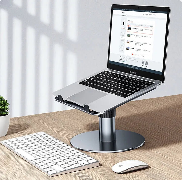 Adjustable silver aluminium car laptop stand with height settings and non-slip pads on a car seat.