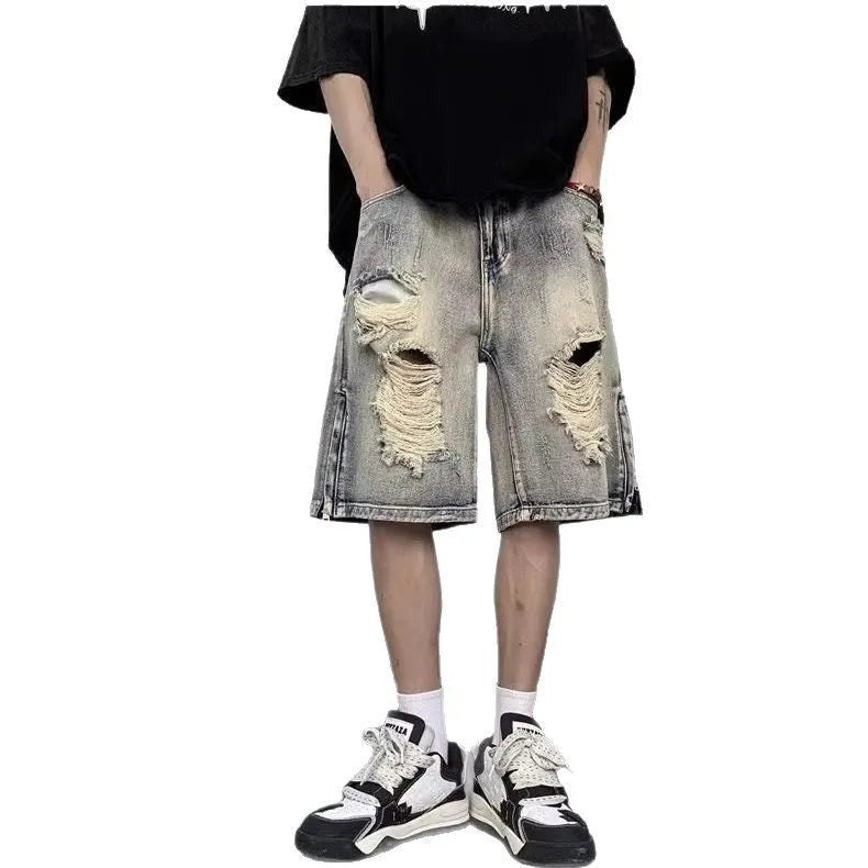 Blue retro denim shorts with a tattered finish and loose wide-leg cut on a mannequin