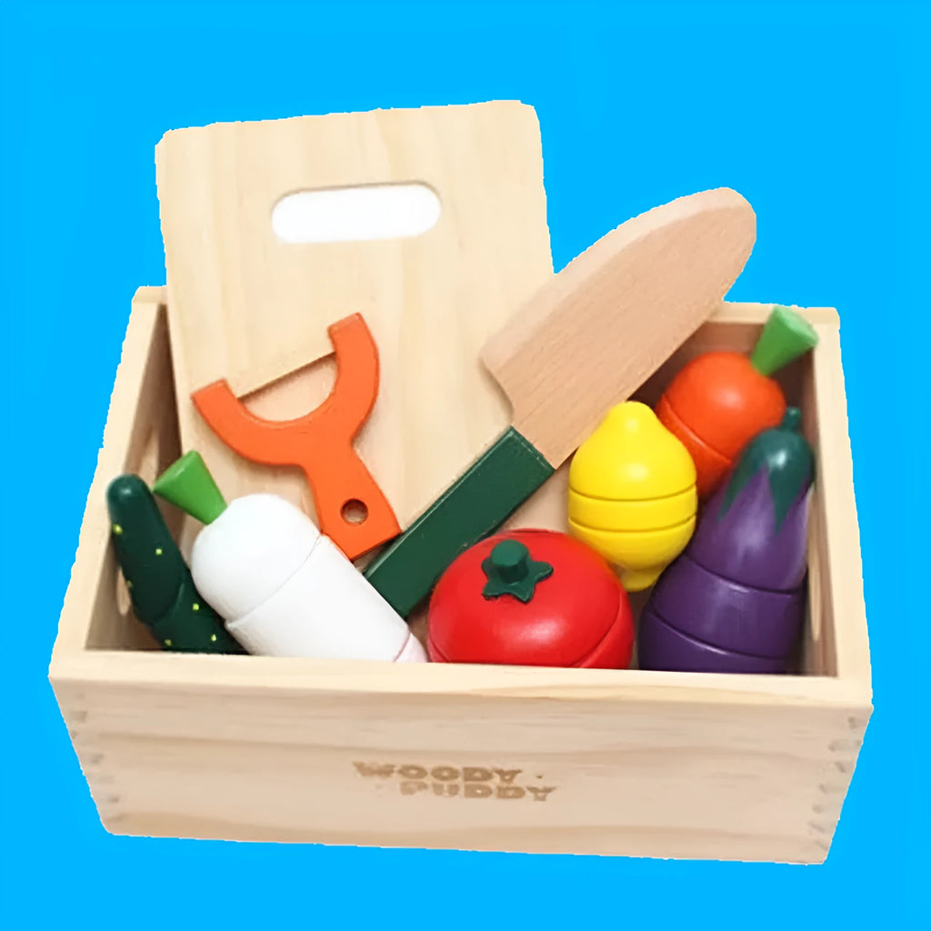 Children's wooden magnetic fruit and vegetable slicer toy on a table