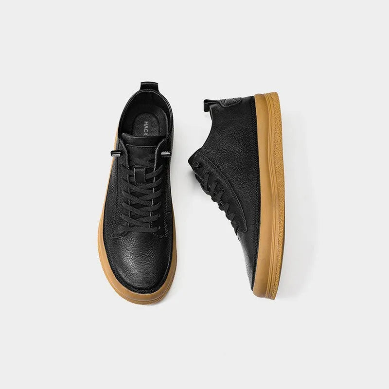 Men's black leather casual shoes with round toe and lanyard closure on white background