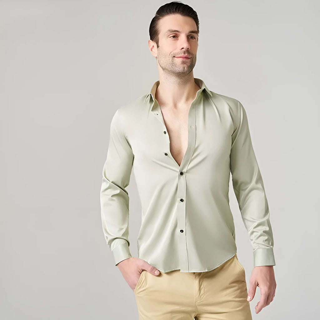 Man wearing a stretch long sleeve polyester work shirt in a solid colour, showing the fit and long sleeve design.