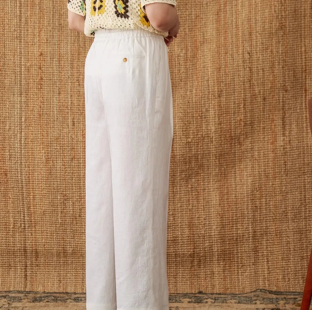 Straight-leg linen trousers with elasticated high waist in greige, navy blue, and white colours