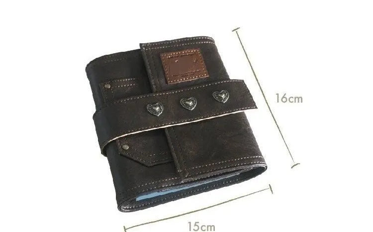 Brown A7 PU leather buckle notebook with loose-leaf binder binding on wooden surface