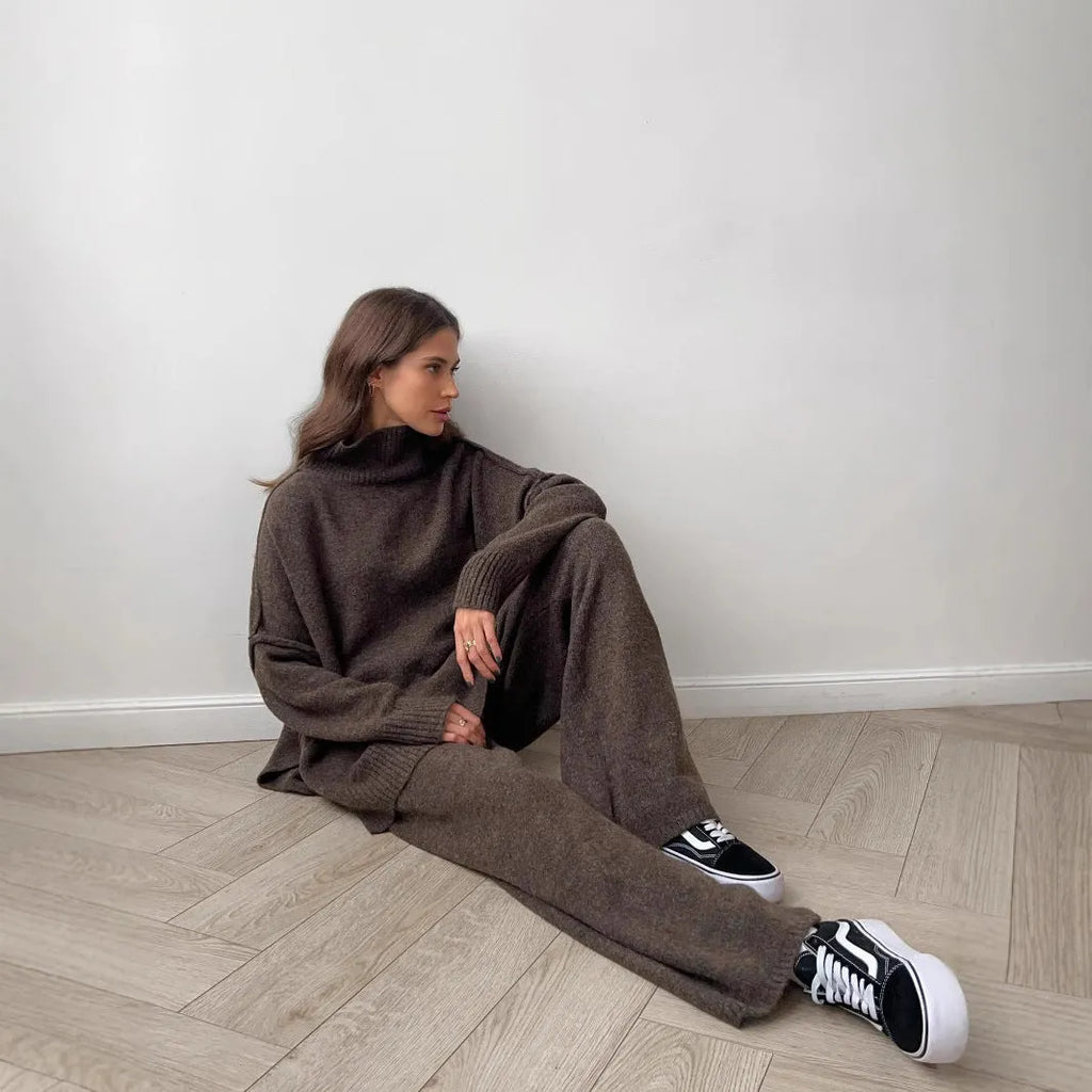 Women's acrylic suit with side-slit sweater top and matching trousers in solid colour