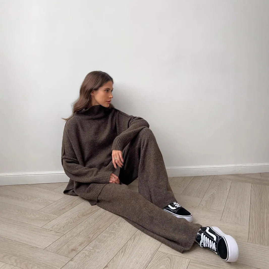 Women's acrylic suit with side-slit sweater top and matching trousers in solid colour