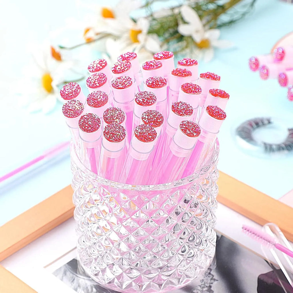 Disposable eyelash brushes in protective tubes with bendable heads for mascara and lash extensions
