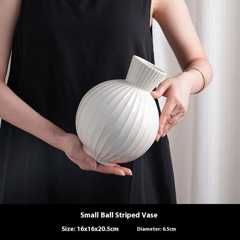 White ceramic ball vase with vertical stripes in American country style for table decoration