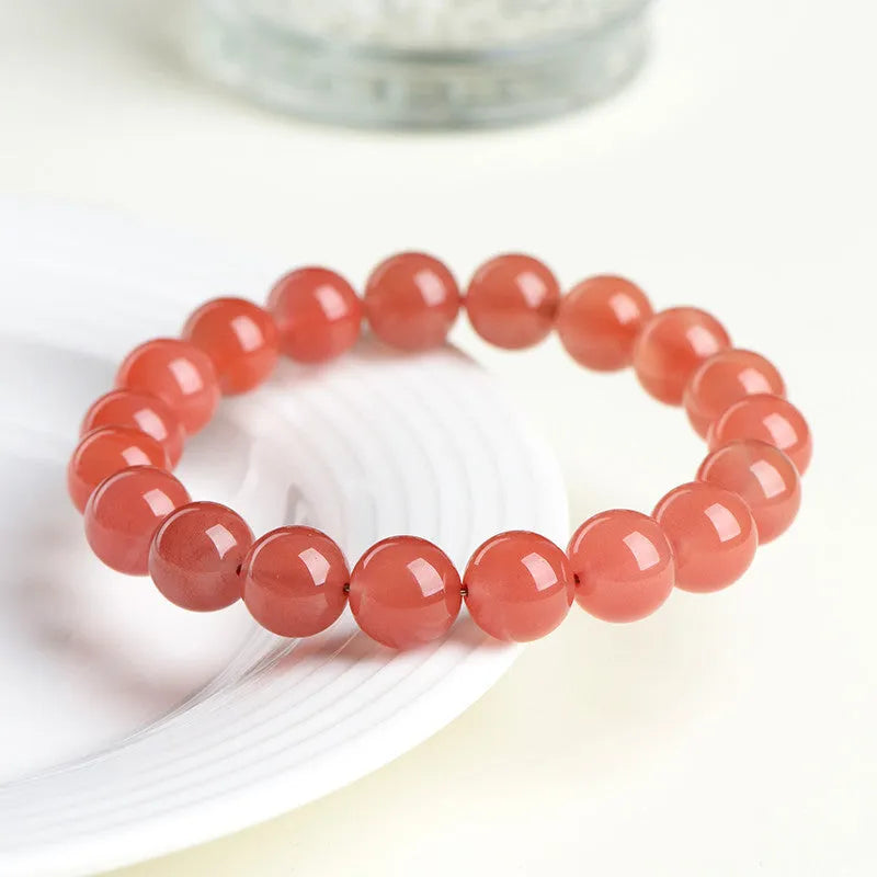Natural South Red Cherry Agate bracelet showing polished beads in a single circle design.