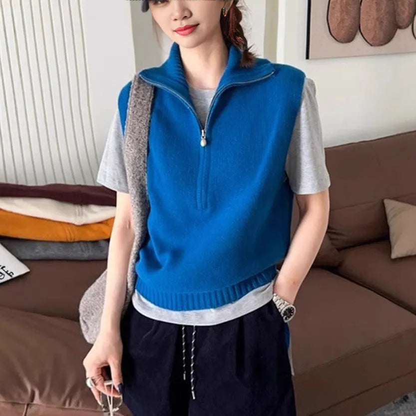 Retro half zip sleeveless knit vest in mesh polyester fabric showing 3D pattern detail