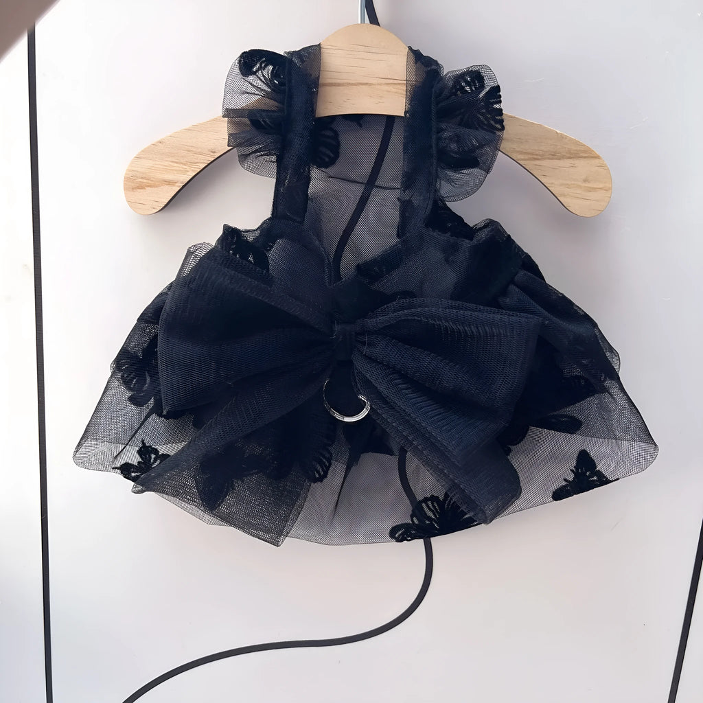 Black tulle princess skirt pet costume on small dog with size chart showing five available sizes