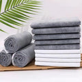 Pack of disposable pet urine pads showing different sizes and the bamboo charcoal deodorising model.