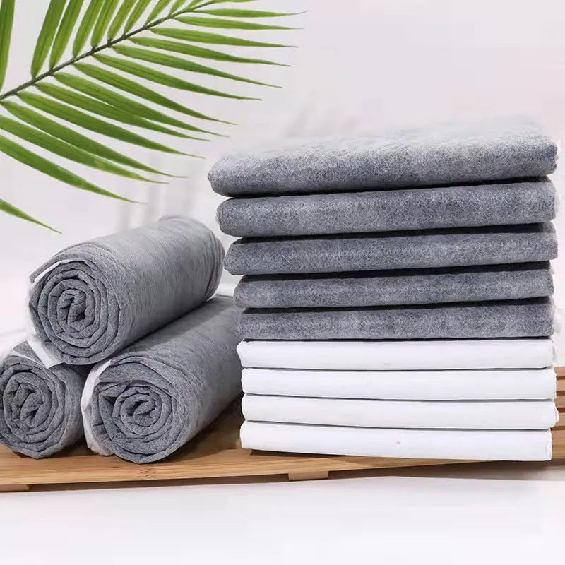 Pack of disposable pet urine pads showing different sizes and the bamboo charcoal deodorising model.