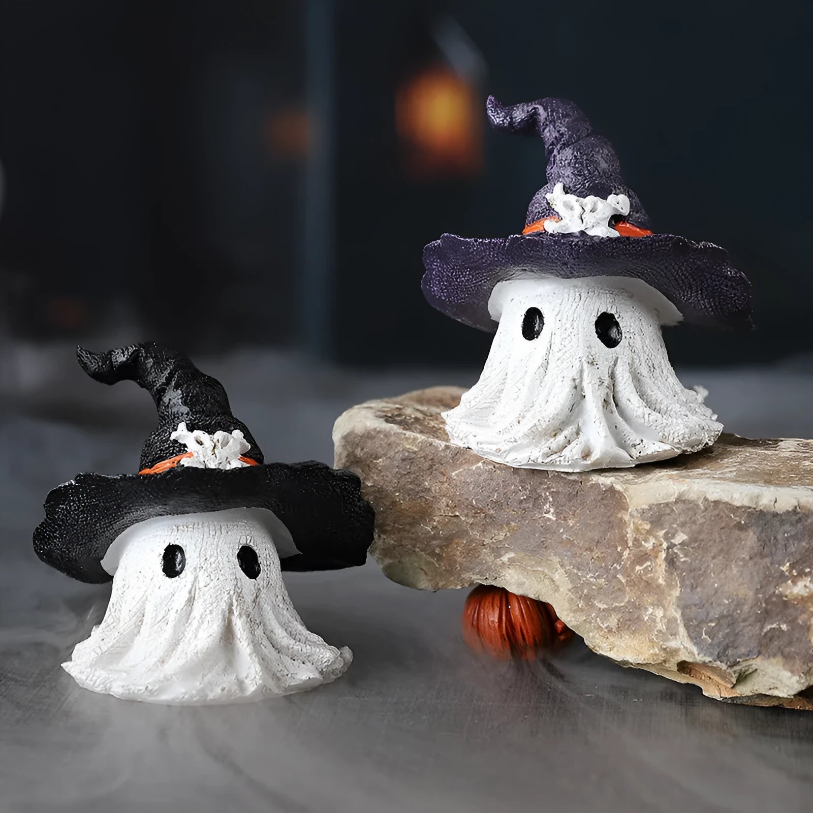 Purple and black solid resin wizard hat ghost ornaments for Halloween and Christmas decor.