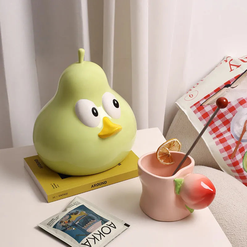 White ceramic pear-shaped tissue box holder with cute animal design in black or green colour