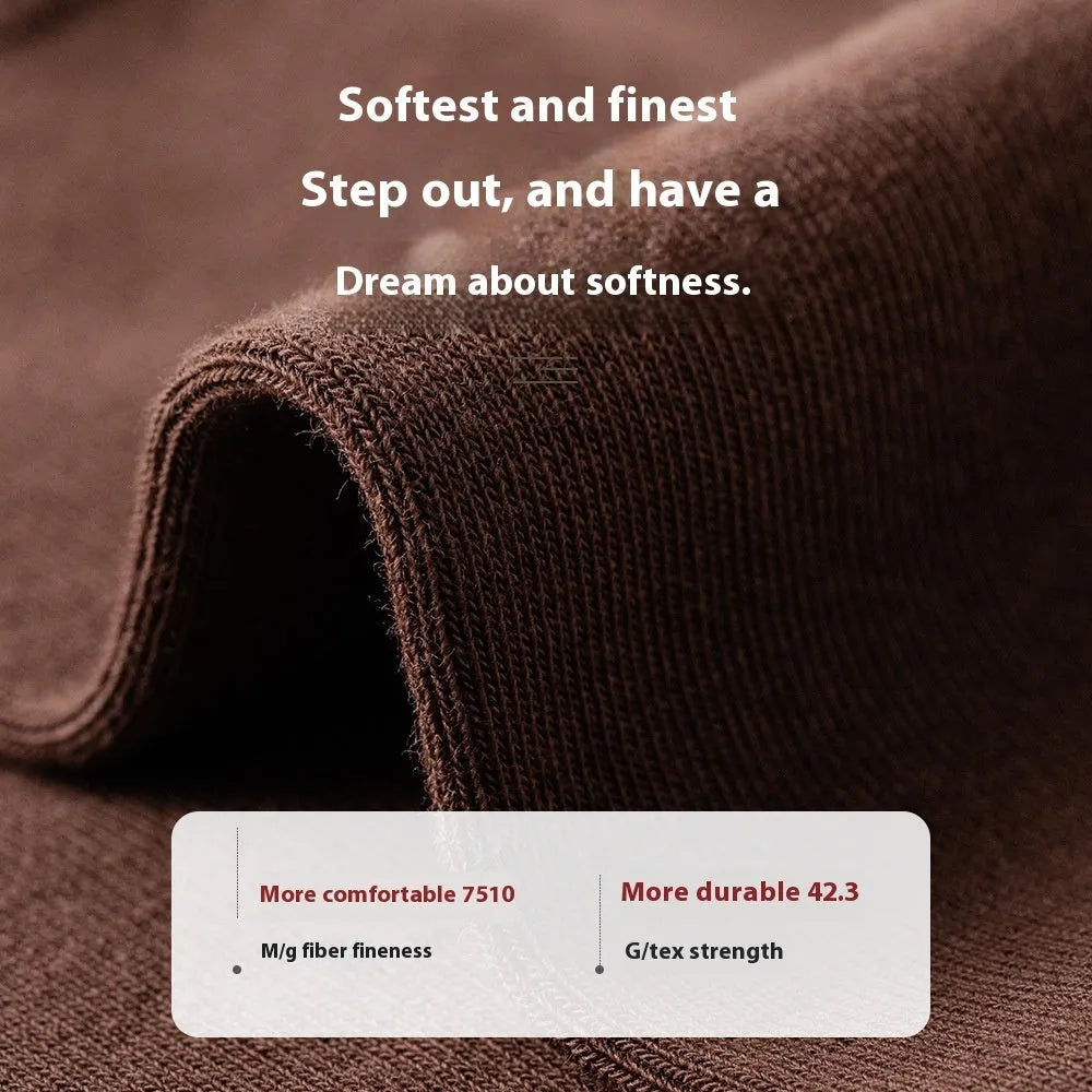 Men's solid colour mid-calf socks in combed cotton, shown in a range of neutral shades including beige, black, and dark blue.