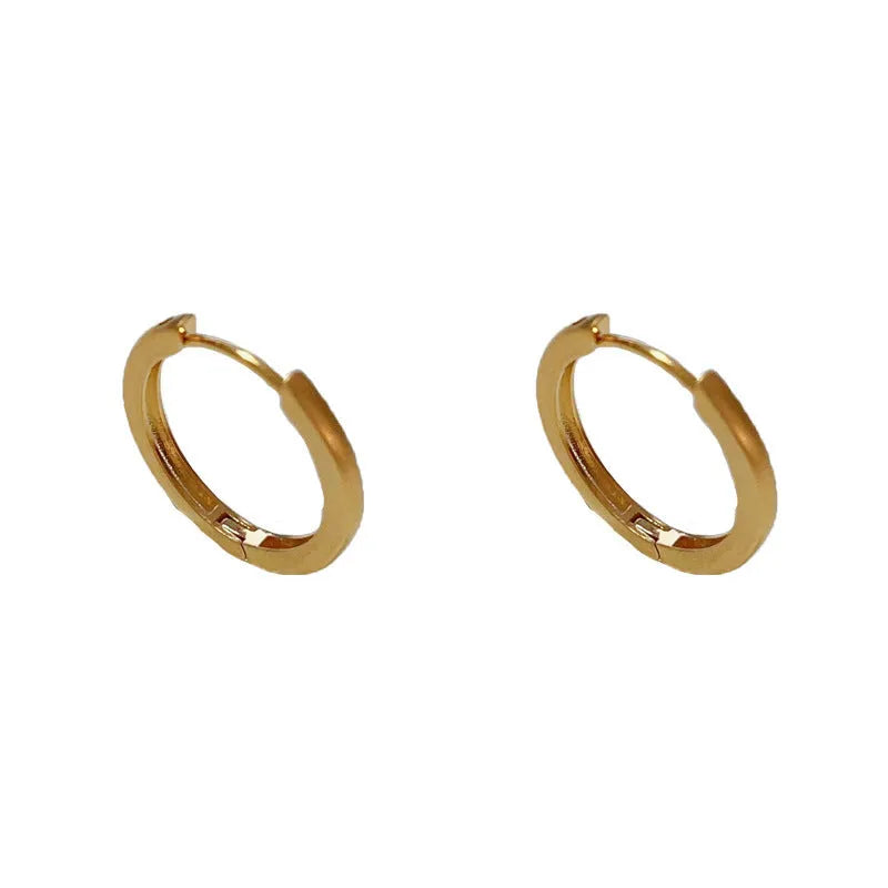 Women's geometric round ear clips with gold plating on copper in gold and silver colour options