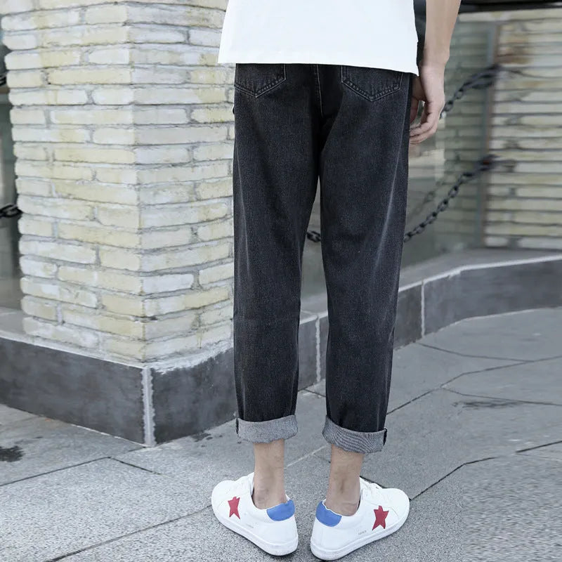 Men's loose straight-leg harem jeans in cotton, shown in blue colour on a neutral background.