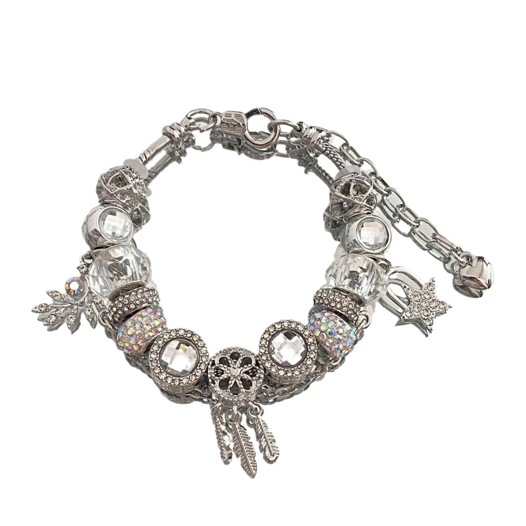 Women's dream catcher star bracelet with colourful crystals and electroplated finish on a white background