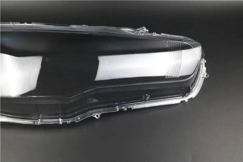 Transparent plastic headlight housing covers for driver and passenger positions