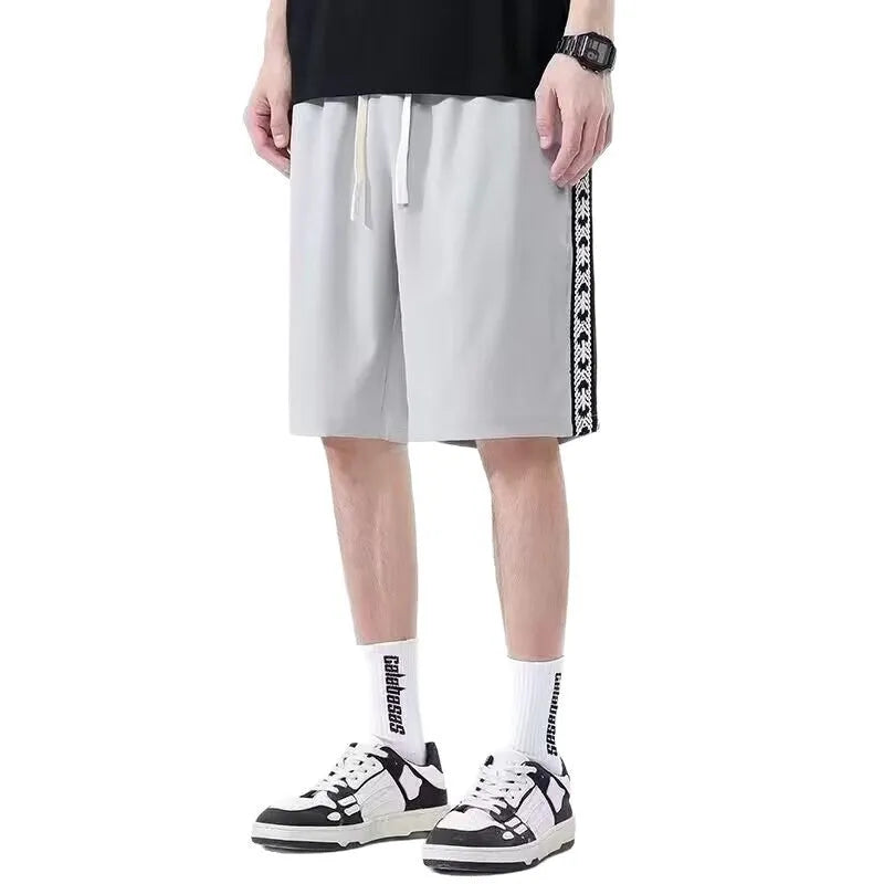 Men's loose-fitting track pants in black with micro-elastic construction and sports style design