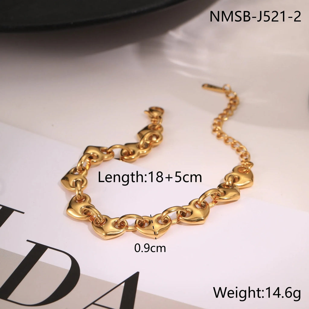 Women's stainless steel bracelet featuring a hollowed-out geometric heart design in gold or steel finish.