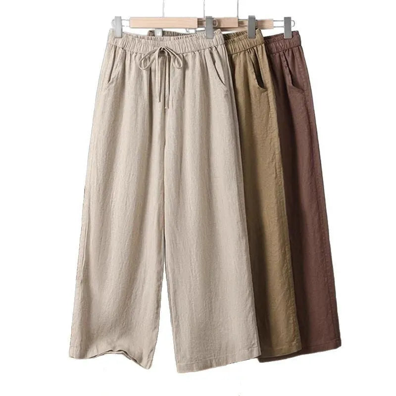 Women's straight leg casual trousers with a drawstring elastic waist in apricot colour.
