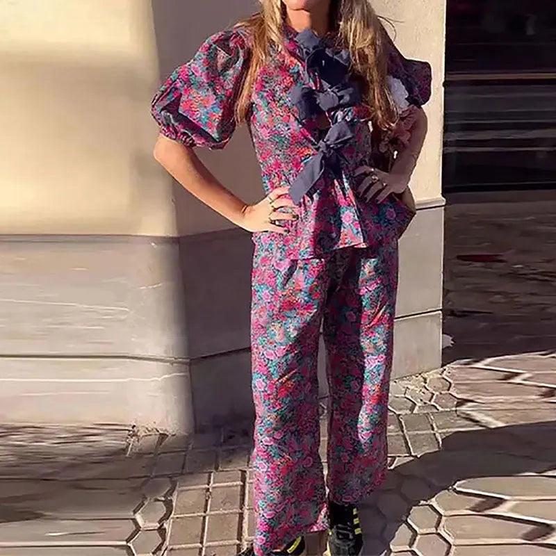 Women's floral print trouser suit with puff sleeve blouse and matching trousers