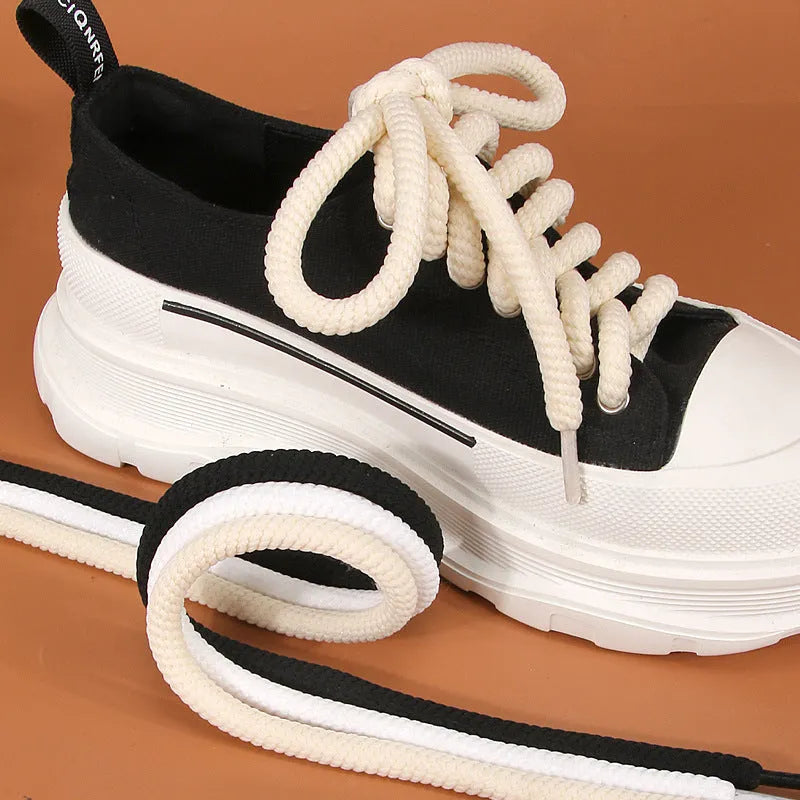 Solid colour round woven shoelaces for bread shoes in white, beige, and black.